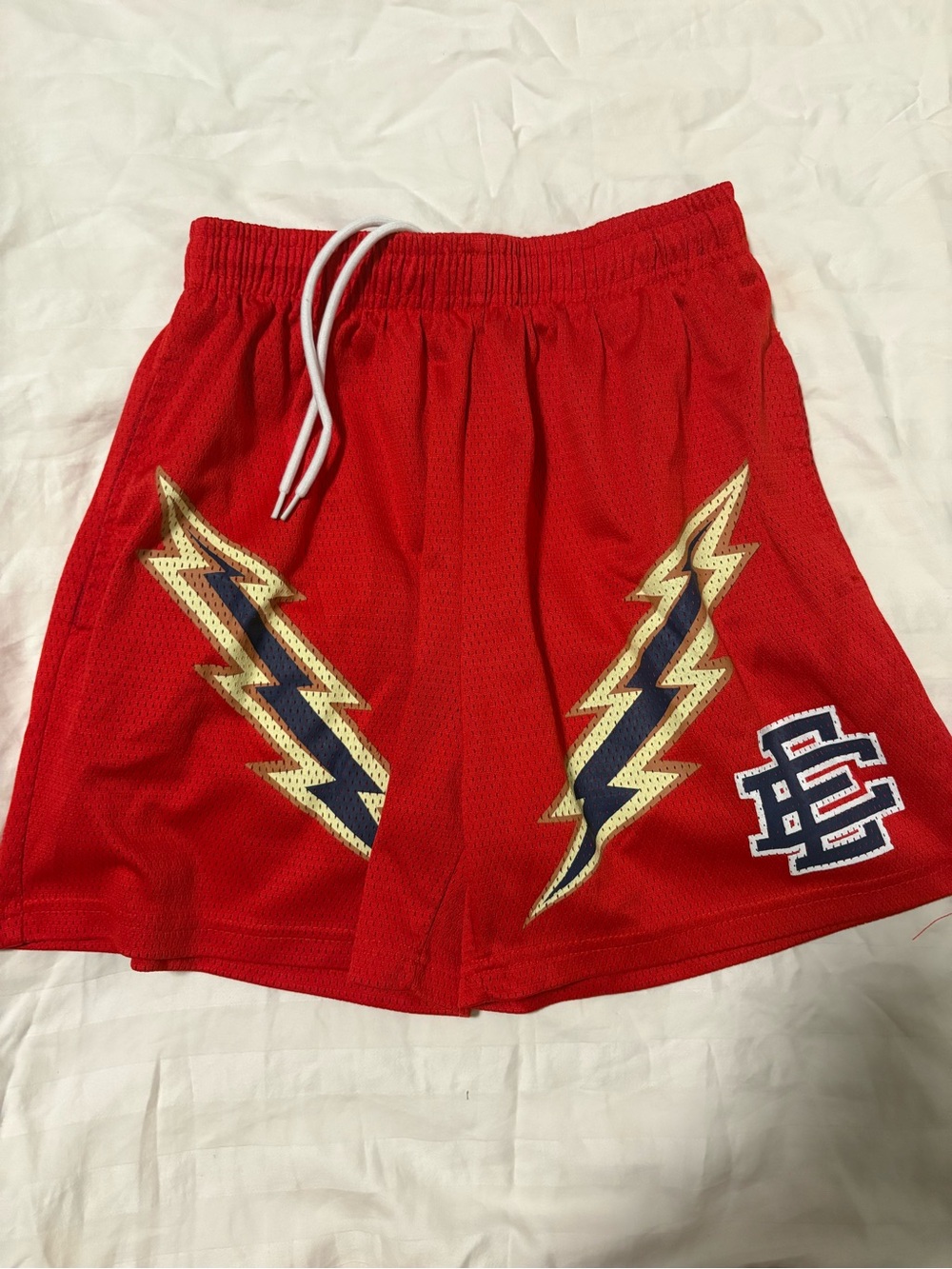 Red Athletic Mesh Shorts with Lightning Graphic